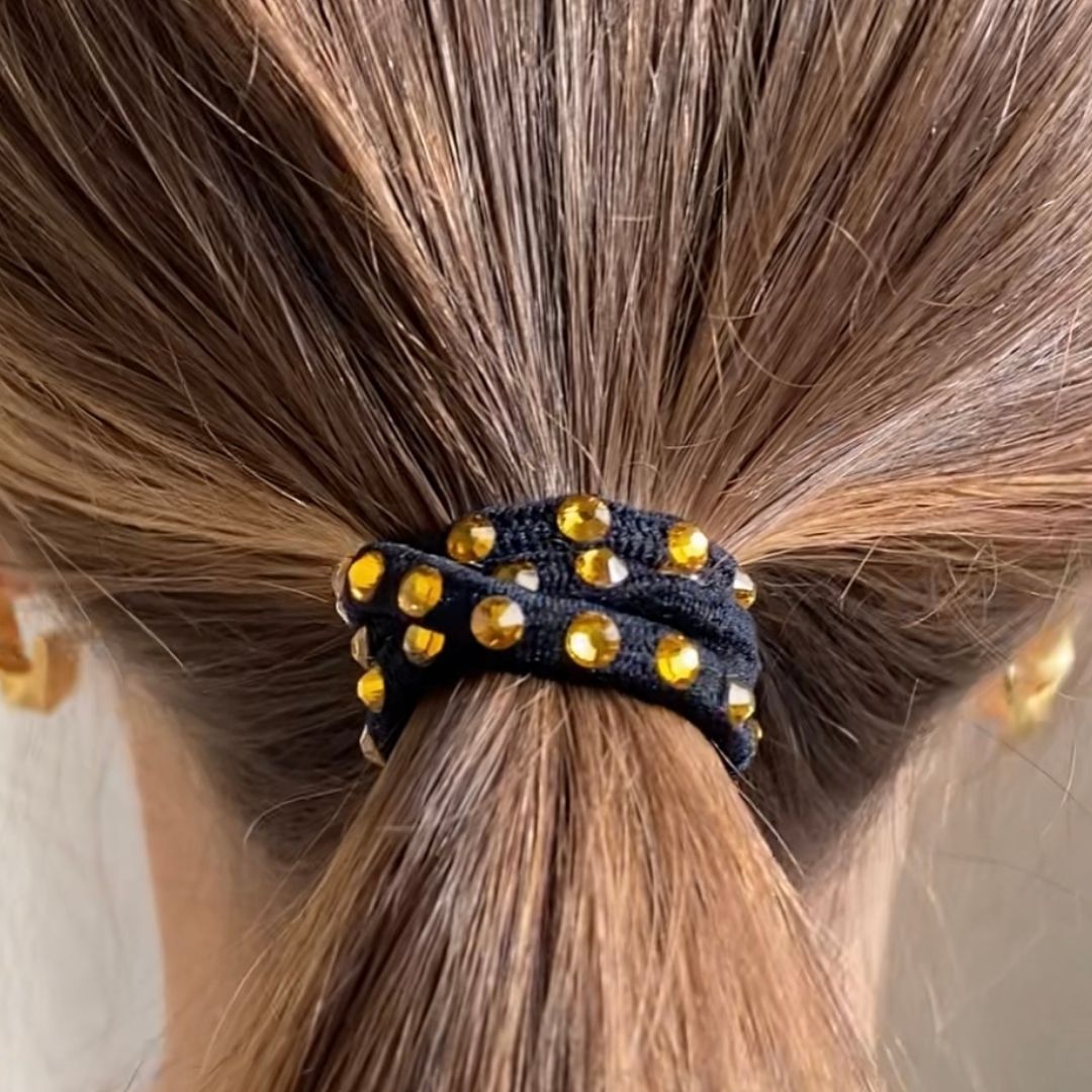 Swarovski Elements Crystal hair elastics in a rainbow of colors from clear to red to emerald to sky blue.