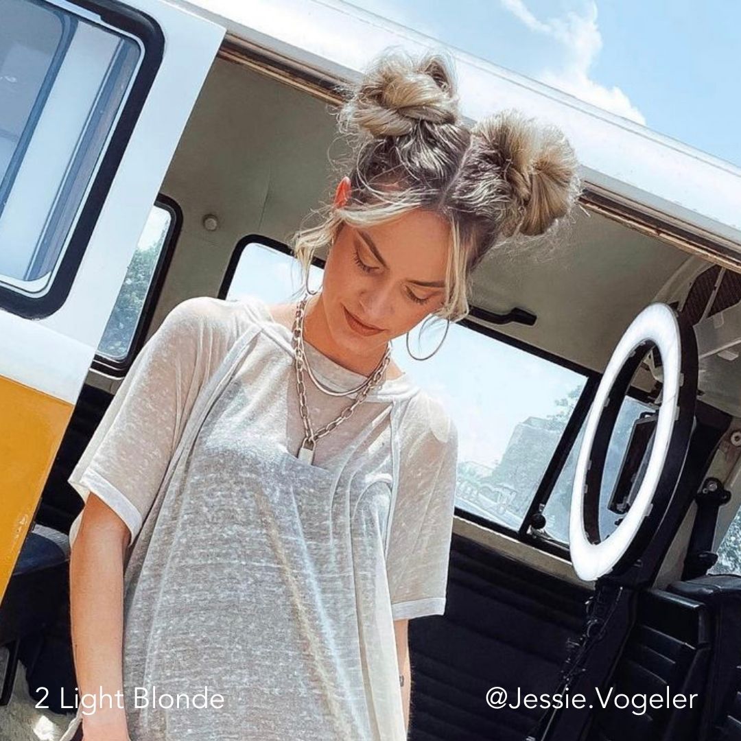 Space Buns for Thin Fine Hair using Easy Updo Extensions with woman walking out of a yellow VW Van created by Jessie Vogeler